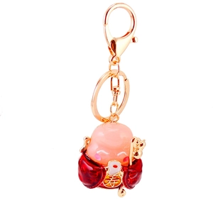 Cartoon Longevity God keychain with red resin body and golden Chinese Shou character
