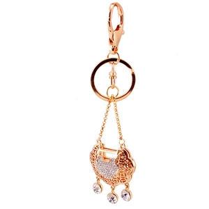 Rose gold metal long life lock keychain with heart shaped crystal accents and hanging gems