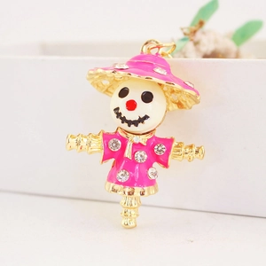 Creative rhinestone scarecrow keychain in pink enamel and gold-plated metal for women