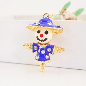 Creative scarecrow keychain with blue enamel and rhinestones on a gold metal base