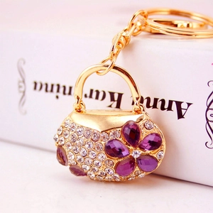 Sparkling crystal handbag keychain with purple rhinestone flower and golden metal base