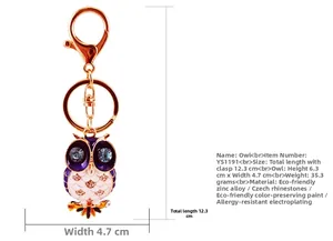 Macro detail showing dimensions of purple crystal owl keychain in zinc alloy