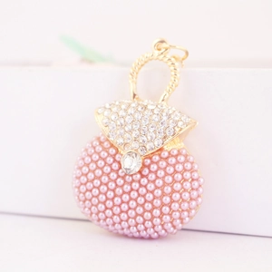 Porte-clés sac à main perles roses avec strass et anse spirale dorée pour femme