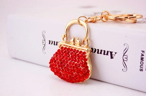 Detail of red rhinestone handbag keychain with gold metal frame and lobster clasp