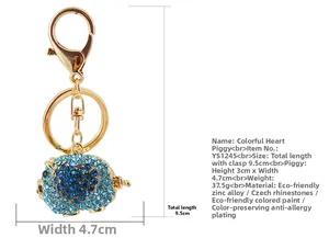 Detailed view of pig keychain dimensions with blue rhinestones and zinc alloy specs