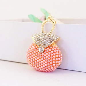 Pink rhinestone handbag keychain with pearls and gold metal plating for women