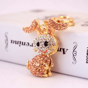 Sparkling pink rhinestone bunny keychain in gold-tone metal for handbags and car keys