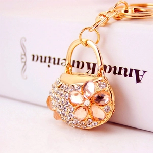 Elegant gold-plated handbag keychain with pink crystal flowers and sparkling rhinestones