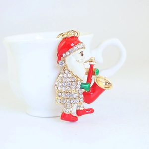 Sparkling Santa Claus saxophone keychain with crystals and colorful enamel finish