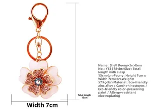 Detail view of pink shell peony keychain with sparkling rhinestones and rose gold ring