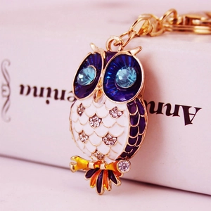 Cute crystal owl keychain with white enamel and blue rhinestone eyes on gold metal