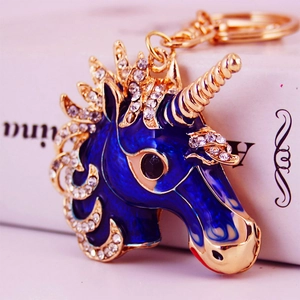Sparkling crystal unicorn head keychain with blue enamel and gold-plated metal finish