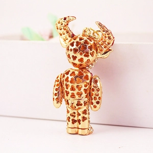 Fashionable gold devil bull keychain with hollow clover pattern and rhinestones
