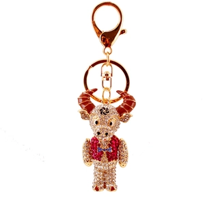 Sparkling crystal rhinestone ox keychain with gold plating and red suit detail accessory