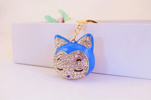 Detail of royal blue fox head keychain with sparkling white rhinestones and gold ring