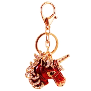 Red unicorn keychain with sparkling crystals and golden enamel pendant for bags