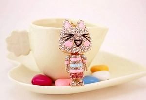 Detail of cute rhinestone cat keychain with sparkling crystals and enamel coating