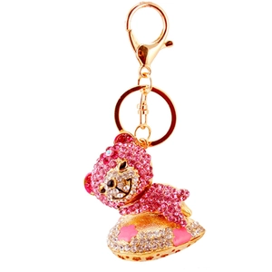 Sparkling pink crystal sleeping bear keychain with gold lobster clasp and heart pendant
