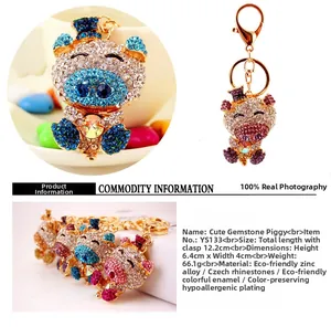 Close-up of crystal pig keychain showing 12.2cm size and polished zinc alloy details
