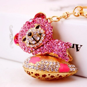 Cute pink crystal bear keychain with sparkling rhinestones and gold flower base
