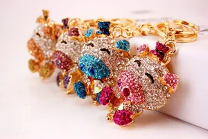 Set of four cute crystal pig keychains with sparkling rhinestones in assorted colors