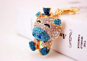 Detailed close-up of a sparkling blue crystal hippo keychain with gold-plated metal clasp