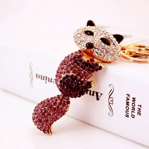 Porte-clés renard étincelant en strass violet et blanc avec placage en métal doré