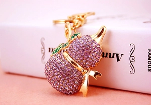 Squisito portachiavi Wu Lou in oro con strass color lavanda e foglie in smalto verde