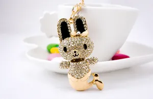 Detail of crystal rabbit mermaid keychain with rhinestones and gold fish tail charm