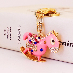 Charming pink rocking horse keychain with sparkling crystals on gold alloy ring