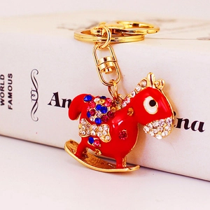 Red rocking horse keychain with colorful rhinestones and gold-plated lobster clasp