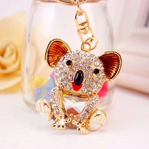 Sparkling crystal koala keychain with white rhinestones and a large faceted gemstone