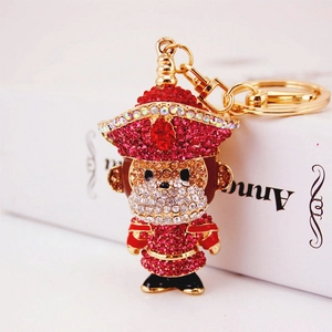 Porte-clés singe en strass étincelants avec motif du zodiaque chinois doré et rouge
