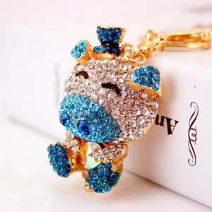 Creative crystal blue pig keychain with golden alloy base and sparkling rhinestones