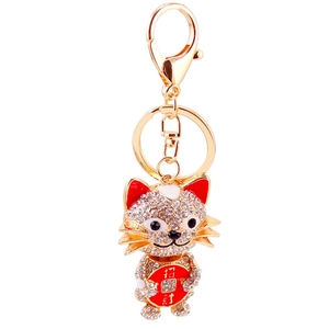 Sparkling crystal lucky cat keychain in gold alloy with red accents for women's bags