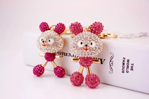 Close-up of sparkling pink and white crystal rhinestone rabbit keychains with gold plating