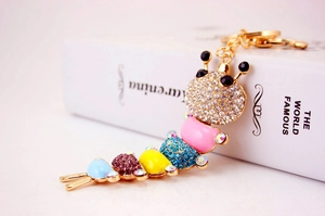 Detailed close-up of a colorful rhinestone caterpillar keychain with gold lobster clasp