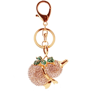 Portachiavi a forma di zucca dorata con strass rosa e foglie in smalto per borse