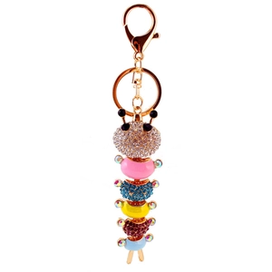 Colorful caterpillar keychain with enamel coating and sparkling crystals on golden alloy