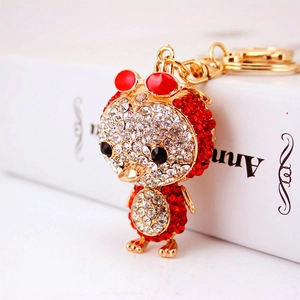 Sparkling crystal owl keychain with gold plating and vibrant red rhinestone accents