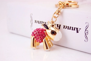 Detail of cute donkey keychain with pink rhinestones and gold metal lobster clasp