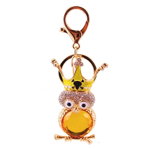 Mignon porte-clés hibou avec couronne en strass, doré avec ventre en pierre jaune