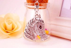 Close-up of sparkling horse head keychain with clear rhinestones and lobster clasp