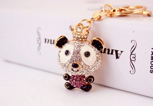 Close-up of luxury panda keychain featuring sparkling rhinestones and a golden crown detail