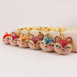 Sparkling rhinestone fox keychains in multiple vibrant colors with golden metal plating