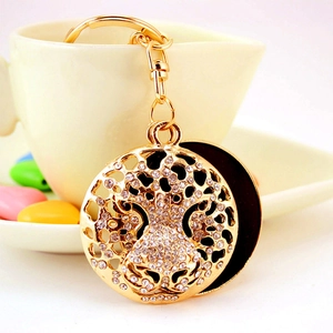 Golden rhinestone leopard head keychain with flip-open mirror and sparkling crystals