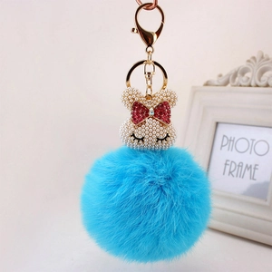 Porte-clés lapin en perles avec pompon en fausse fourrure bleue et fermoir doré