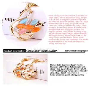 Detail view of colorful opal and rhinestone swan keychain with zinc alloy base