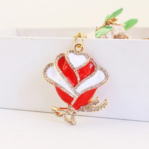 Elegant rose flower keychain with red and white petals, rhinestones and gold ring