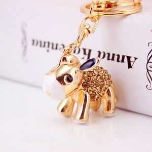 Creative cute cartoon donkey keychain with amber rhinestones and gold finish bag charm